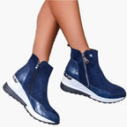 Women's beige wedge ankle boots with a side zip fastening