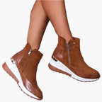 Women's beige wedge ankle boots with a side zip fastening