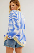 Sky blue striped oversized knit jumper with an oversized, relaxed fit