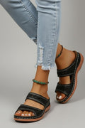 Dual-strap slide sandals with decorative cutouts, product still life