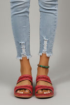 Dual-strap slide sandals with decorative cutouts, product still life