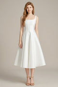 Women's white square neck midi dress with a sleeveless A-line skirt