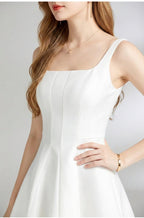 Women's white square neck midi dress with a sleeveless A-line skirt