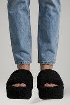 Close-up of buckle fastening on wedge sandals