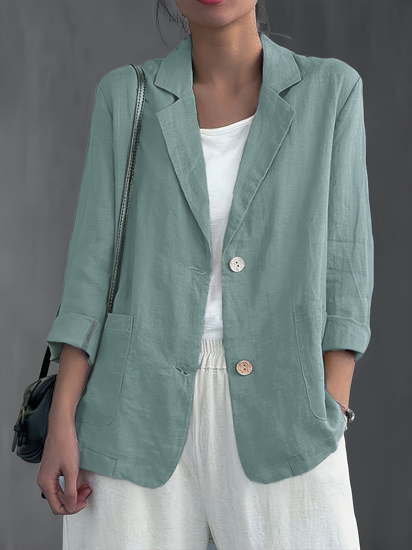 Navy blue casual blazer for women in a relaxed fit with patch pockets
