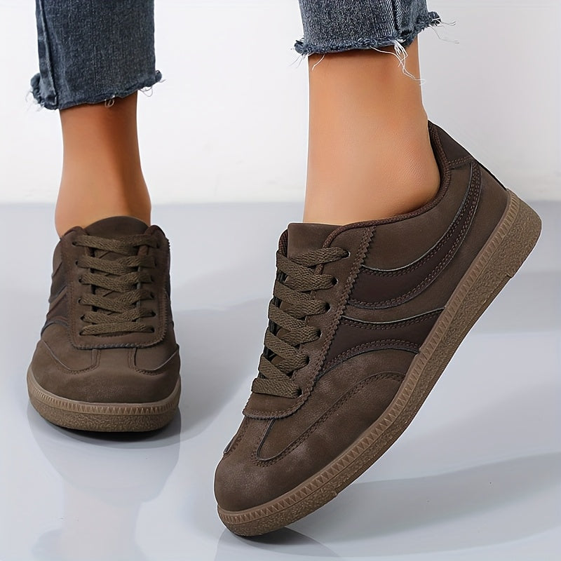 Women's brown retro low top trainers with a vintage-inspired finish