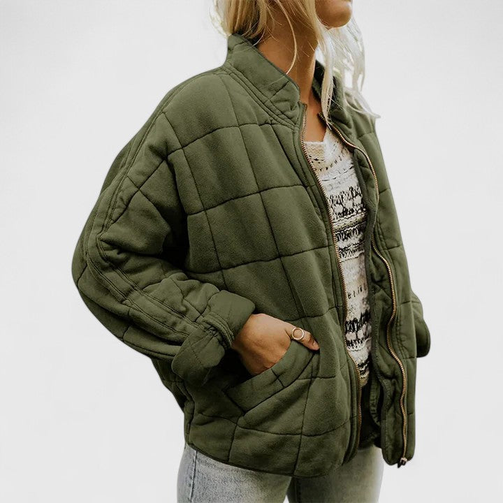 Women's green quilted jacket with a soft lining and relaxed fit