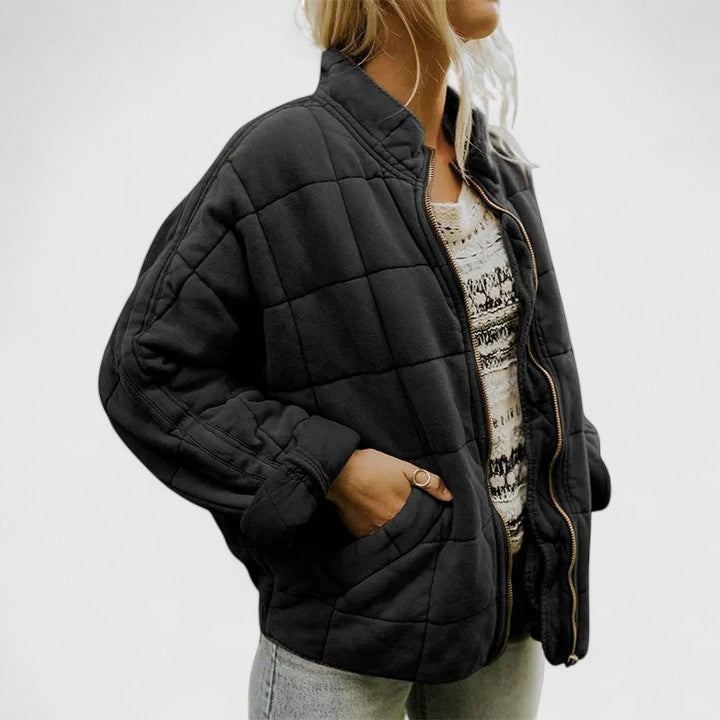 Women's green quilted jacket with a soft lining and relaxed fit