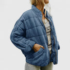 Women's green quilted jacket with a soft lining and relaxed fit