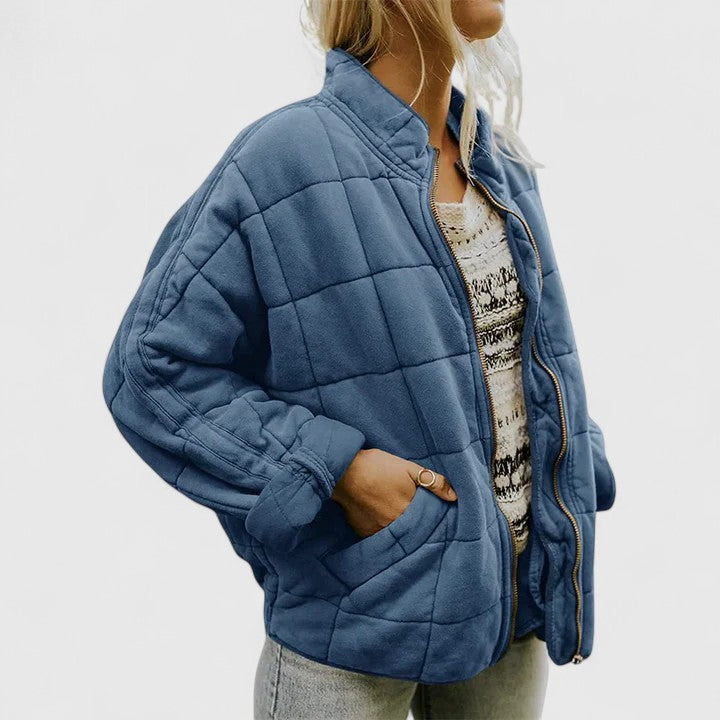 Women's green quilted jacket with a soft lining and relaxed fit