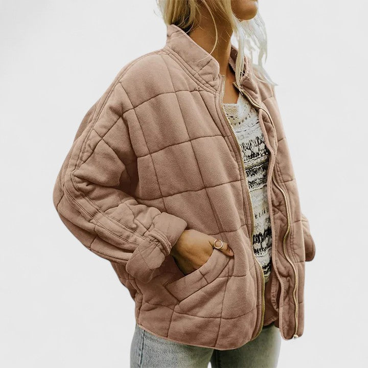 Women's green quilted jacket with a soft lining and relaxed fit