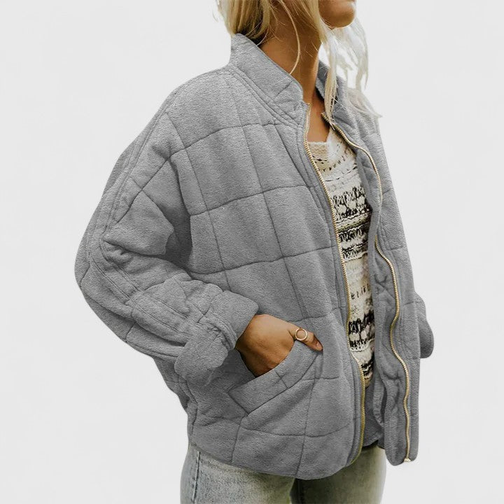 Women's green quilted jacket with a soft lining and relaxed fit