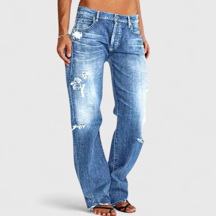 Women's blue baggy distressed jeans with a relaxed leg and high stretch fabric